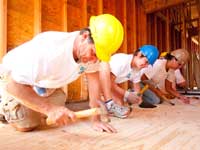 QBE employees donate their time to help build a house with Habitat for Humanity.